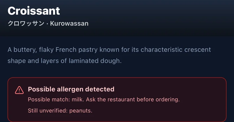 Cartão de um croissant no MenuVista com alerta vermelho: possível presença de leite, perguntar antes de pedir, amendoim ainda não verificado